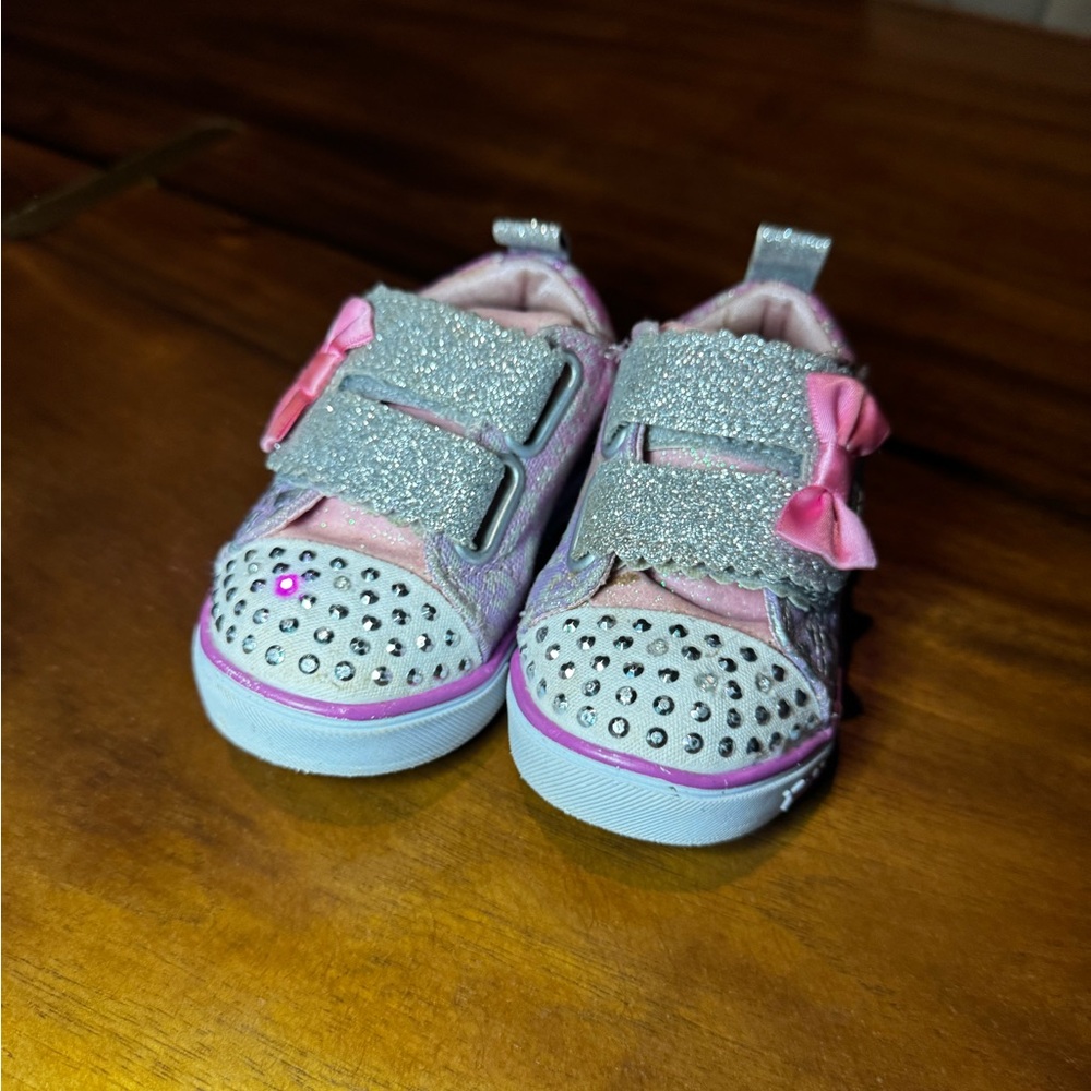 light up sketchers pink&white with bows on it for toddler girl